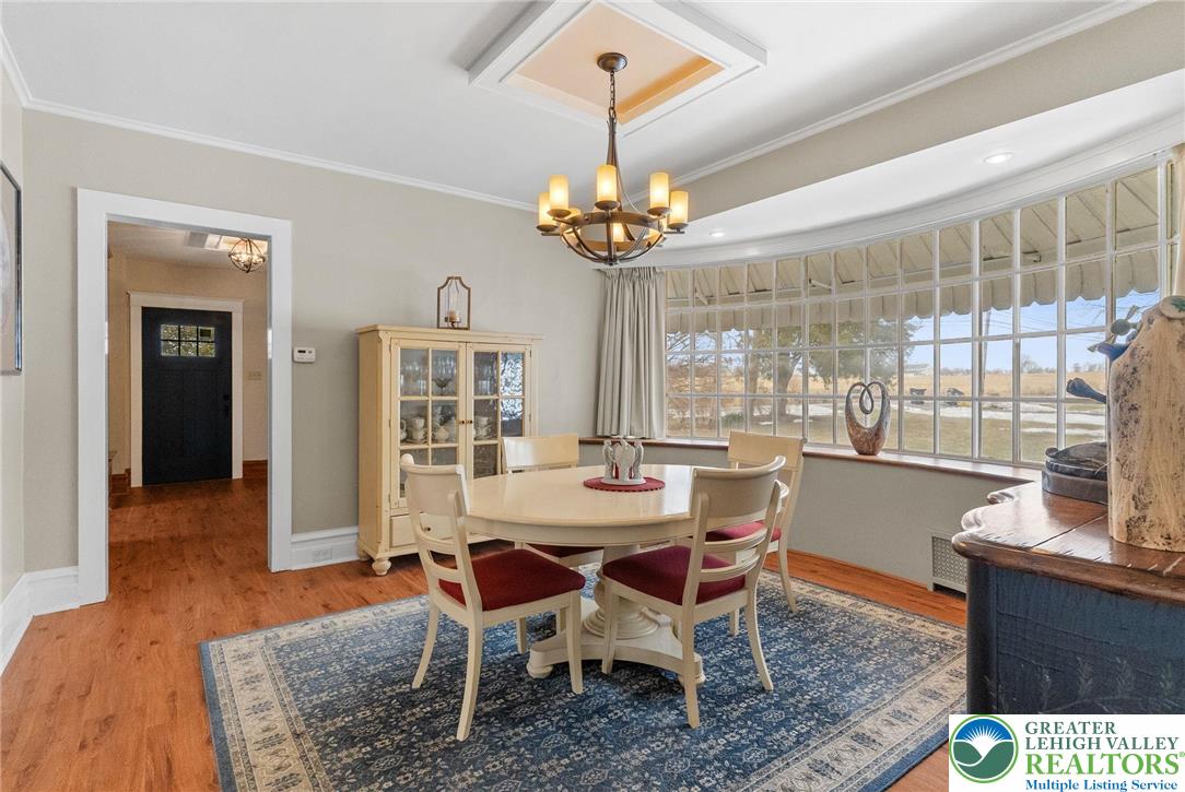 4303 Newburg Road Bethlehem, PA 18020 - Photo 21 of 63 a view of a dining room with furniture wooden floor and chandelier