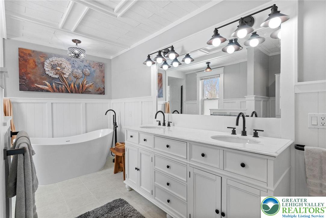 4303 Newburg Road Bethlehem, PA 18020 - Photo 34 of 63 a bathroom with a double vanity sink mirror and bathtub