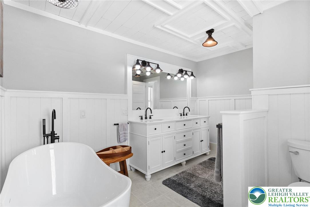 4303 Newburg Road Bethlehem, PA 18020 - Photo 36 of 63 a bathroom with a sink mirror vanity and toilet