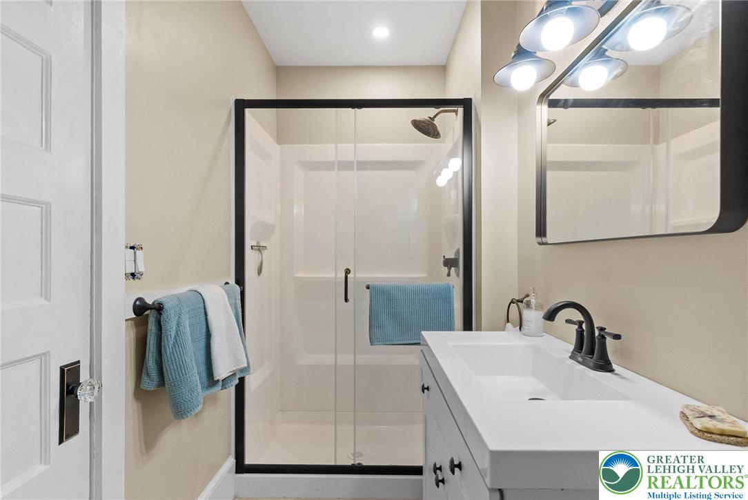 4303 Newburg Road Bethlehem, PA 18020 - Photo 41 of 63 a bathroom with a sink and mirror