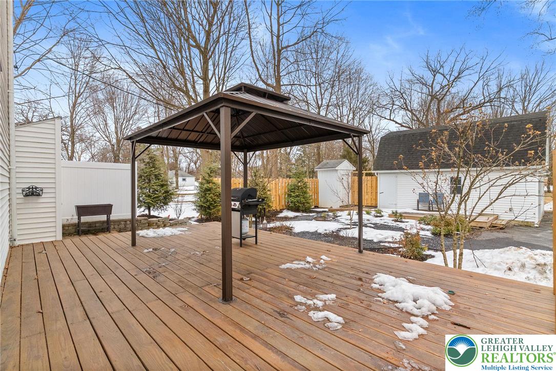4303 Newburg Road Bethlehem, PA 18020 - Photo 47 of 63 a view of a patio with a table chairs and wooden floor