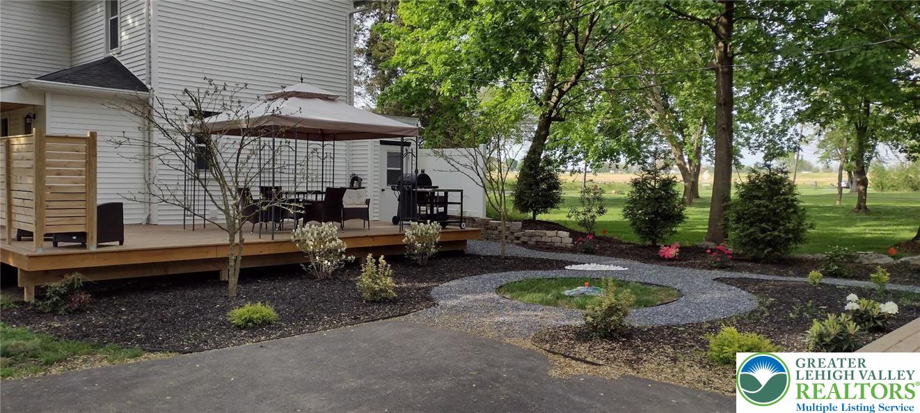 4303 Newburg Road Bethlehem, PA 18020 - Photo 51 of 63 a view of a lounge chair and fire pit in the backyard