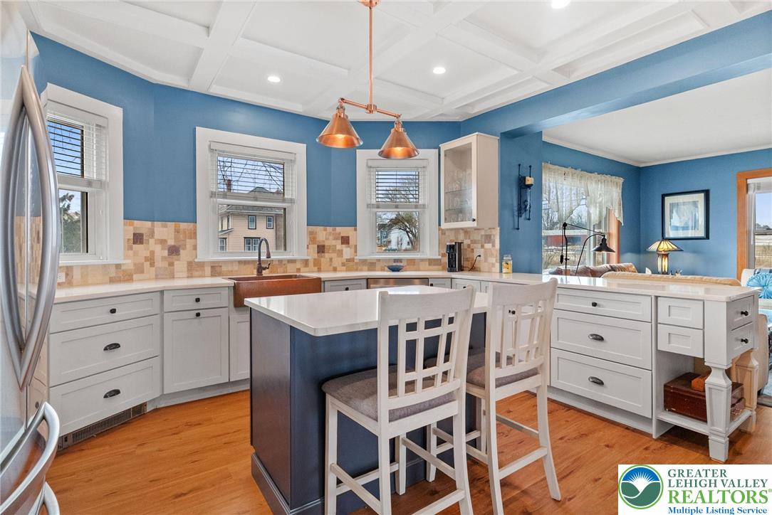 4303 Newburg Road Bethlehem, PA 18020 - Photo 8 of 63 a very nice looking kitchen with granite countertop a stove a sink a dining table and chairs