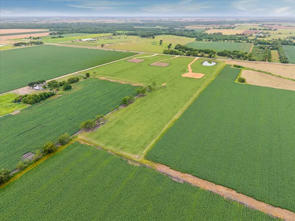 a view of a green field with clear sky
