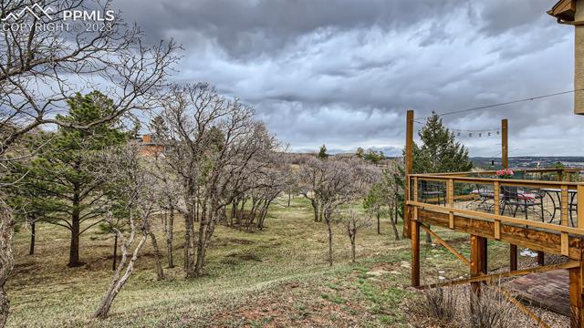 4710 Sandstone Road Monument, CO 80132 - Photo 27 of 28 Rear Deck walks out from the Family room and lower concrete patio with hot tub hook-up.