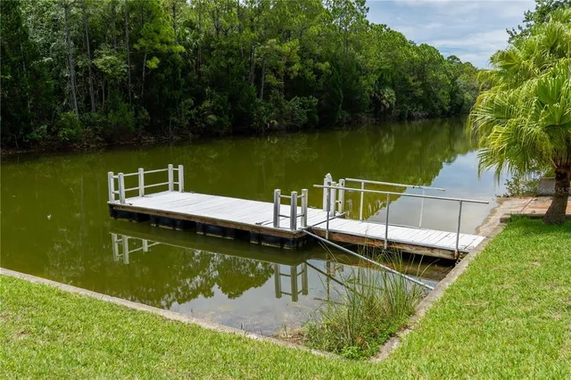 a view of a lake with a house in the background