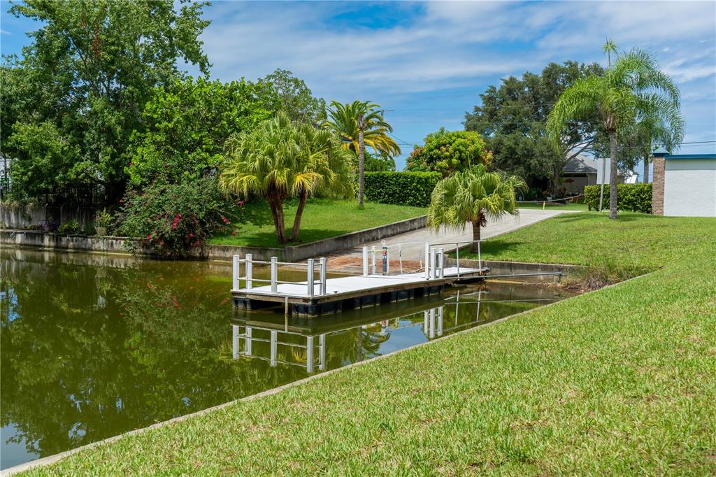 4050 Jew Fish Drive Hernando Beach, FL 34607 - Photo 14 of 16 a view of a lake with a house in the background