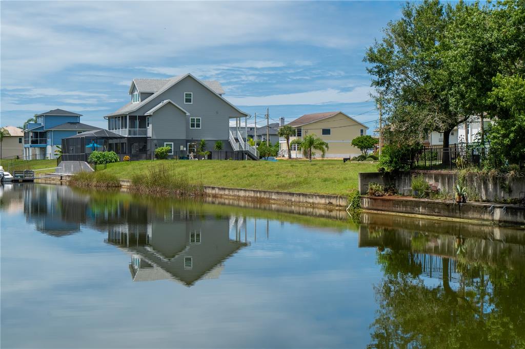 4050 Jew Fish Drive Hernando Beach, FL 34607 - Photo 15 of 16 a view of a house with a yard