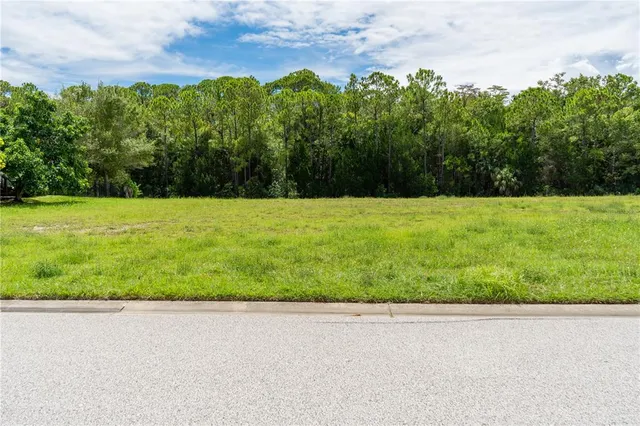 a view of a field with an outdoor space