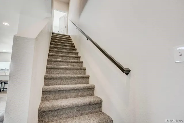 a bathroom with a sink toilet a mirror and shower