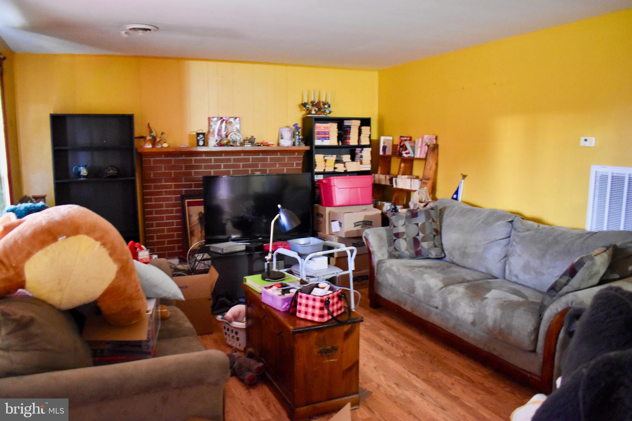 196 Good Mill Road Rileyville, VA 22650 - Photo 11 of 14 a living room with furniture and a fireplace