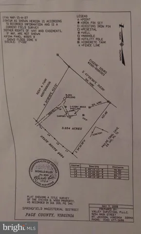 a living room with furniture a fireplace and a window