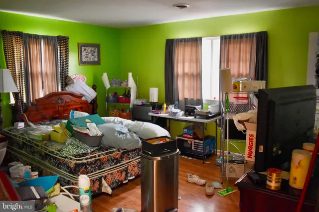 a bedroom with bed and a closet