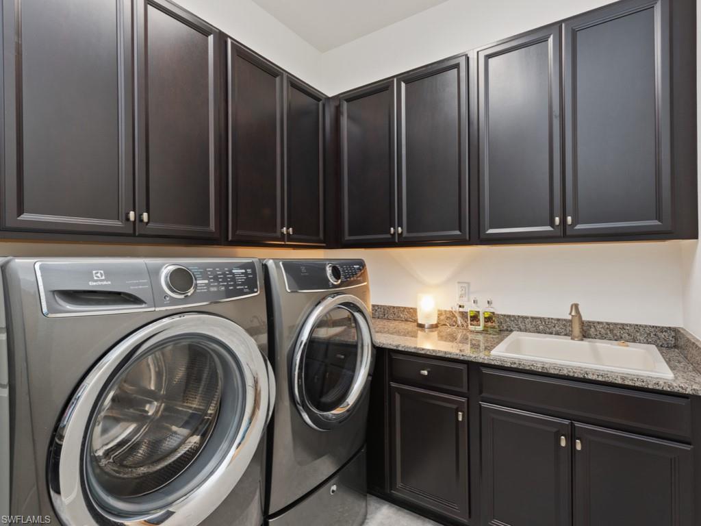 10191 Coconut Road Estero, FL 34135 - Photo 11 of 14 a utility room with sink dryer and washer