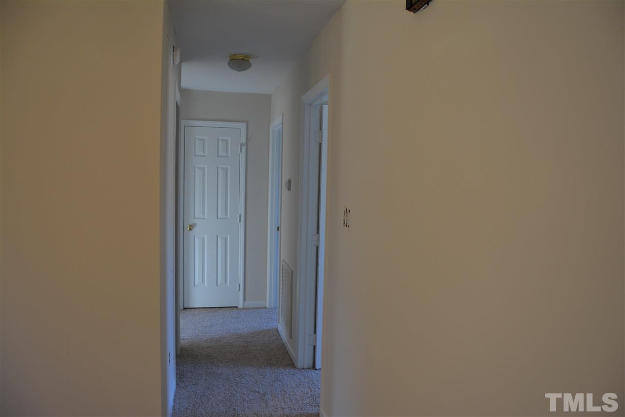 1904 Mishicot Court Raleigh, NC 27604 - Photo 6 of 10 Hall heading to three bedrooms and two baths