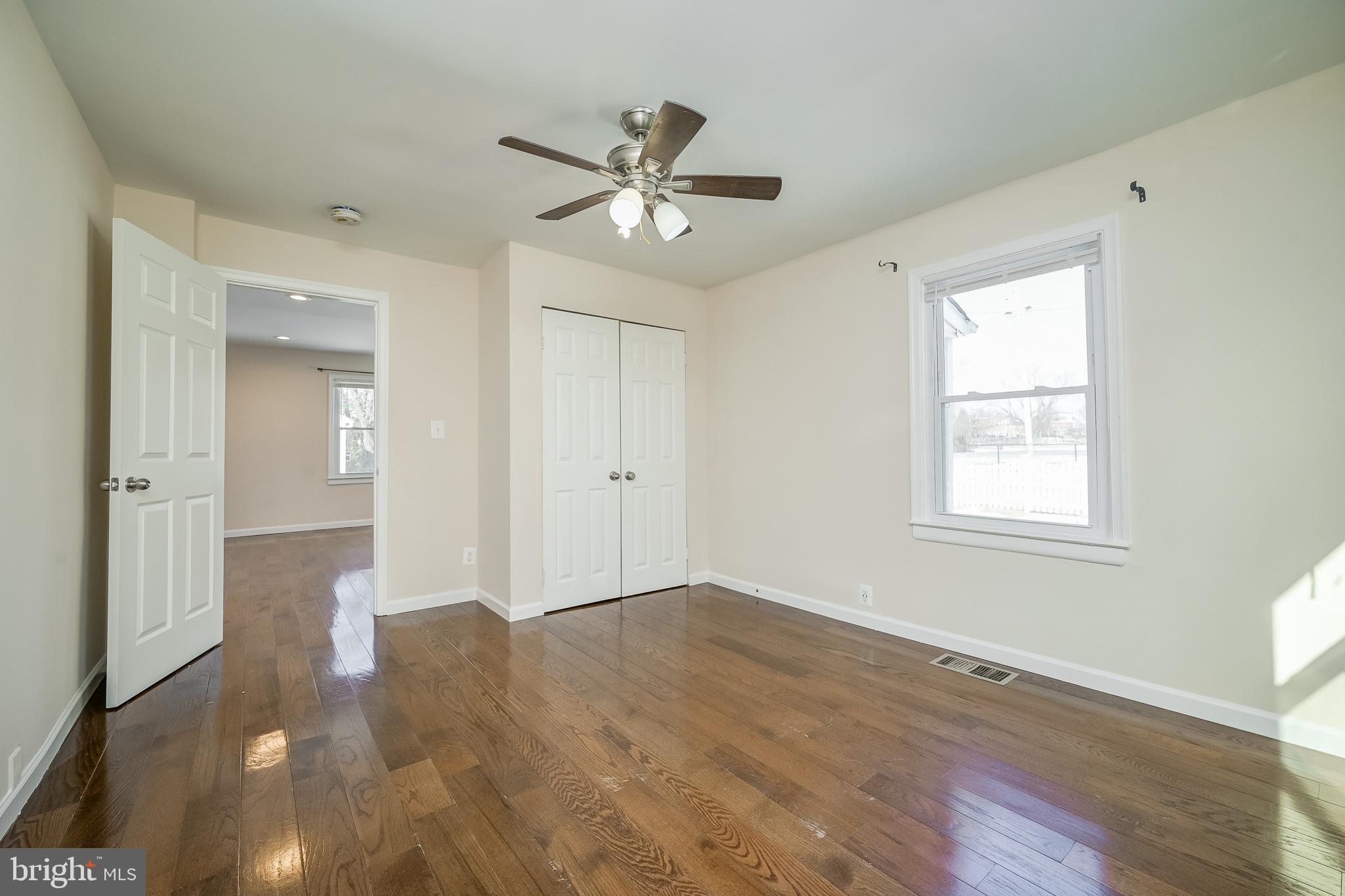 816 Maple Avenue Laurel, MD 20707 - Photo 27 of 45 a view of empty room with wooden floor and fan