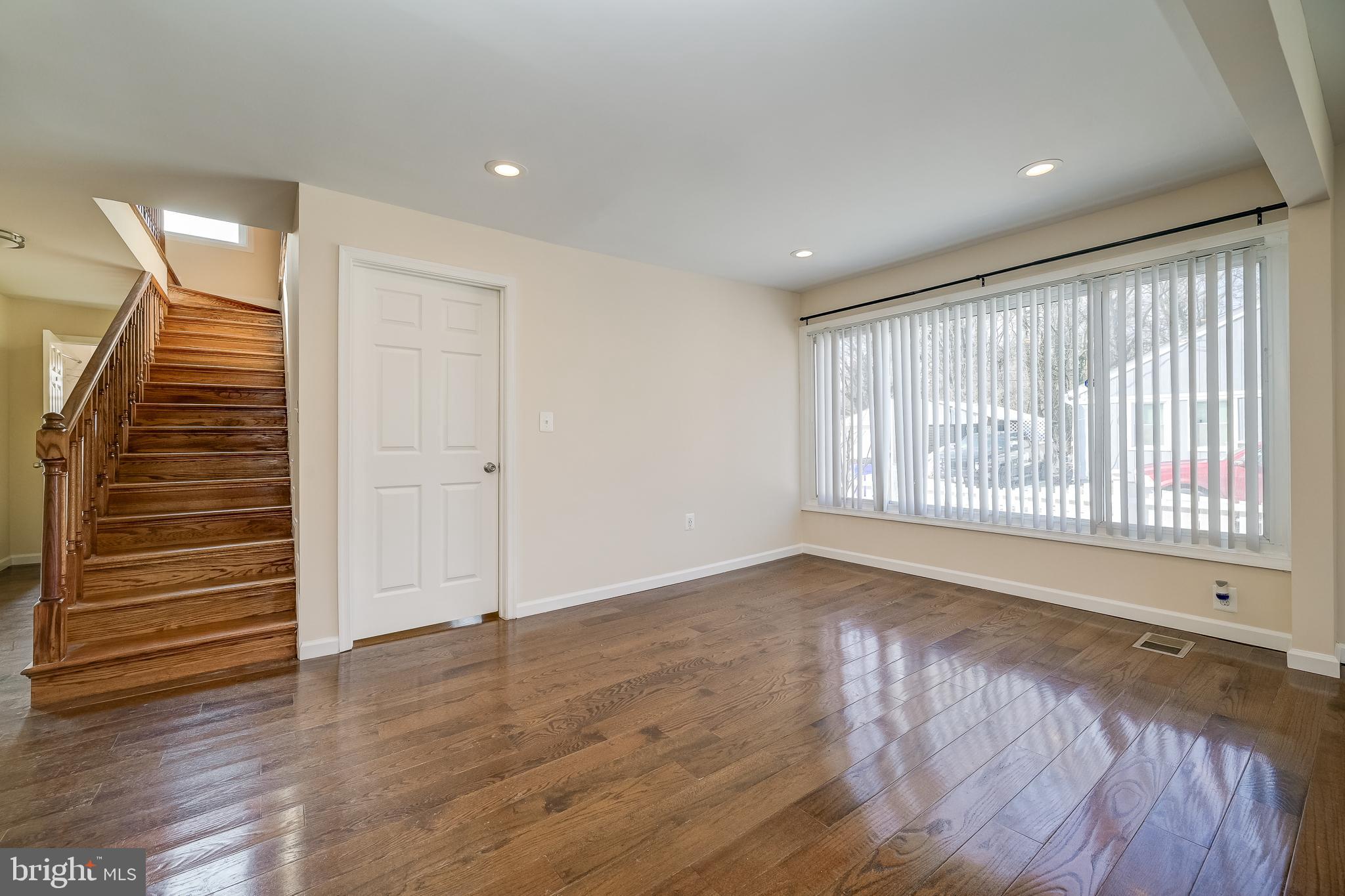 816 Maple Avenue Laurel, MD 20707 - Photo 10 of 45 wooden floor in an empty room with a window