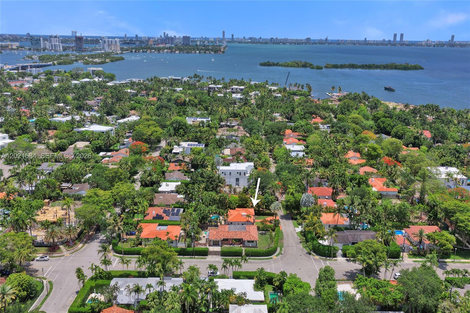 811 Northeast 73rd Street Miami, FL 33138 - Photo 44 of 51 a view of lake and houses with outdoor space