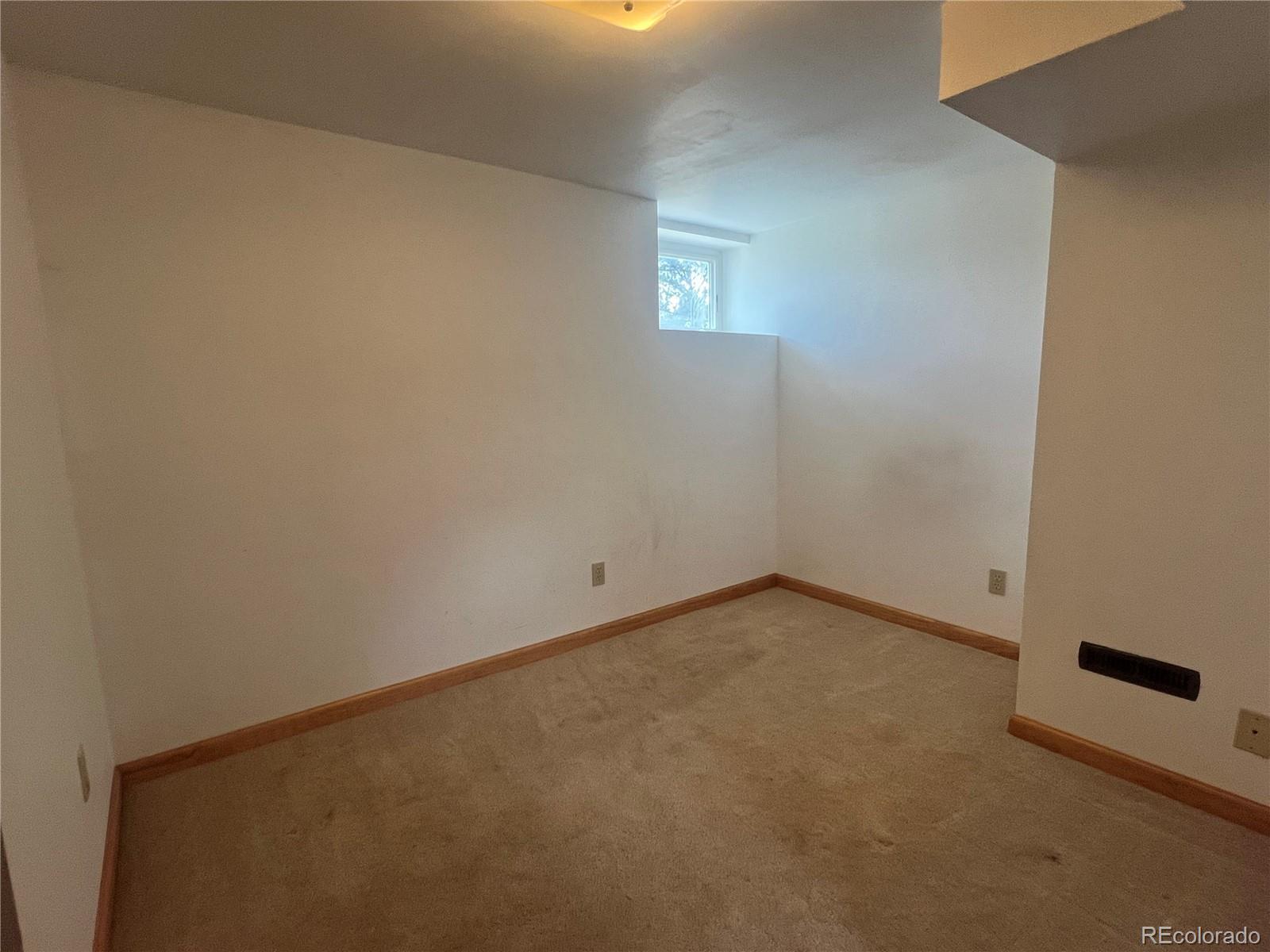 95 Appleby Street Bailey, CO 80421 - Photo 14 of 36 a view of an empty room and a window