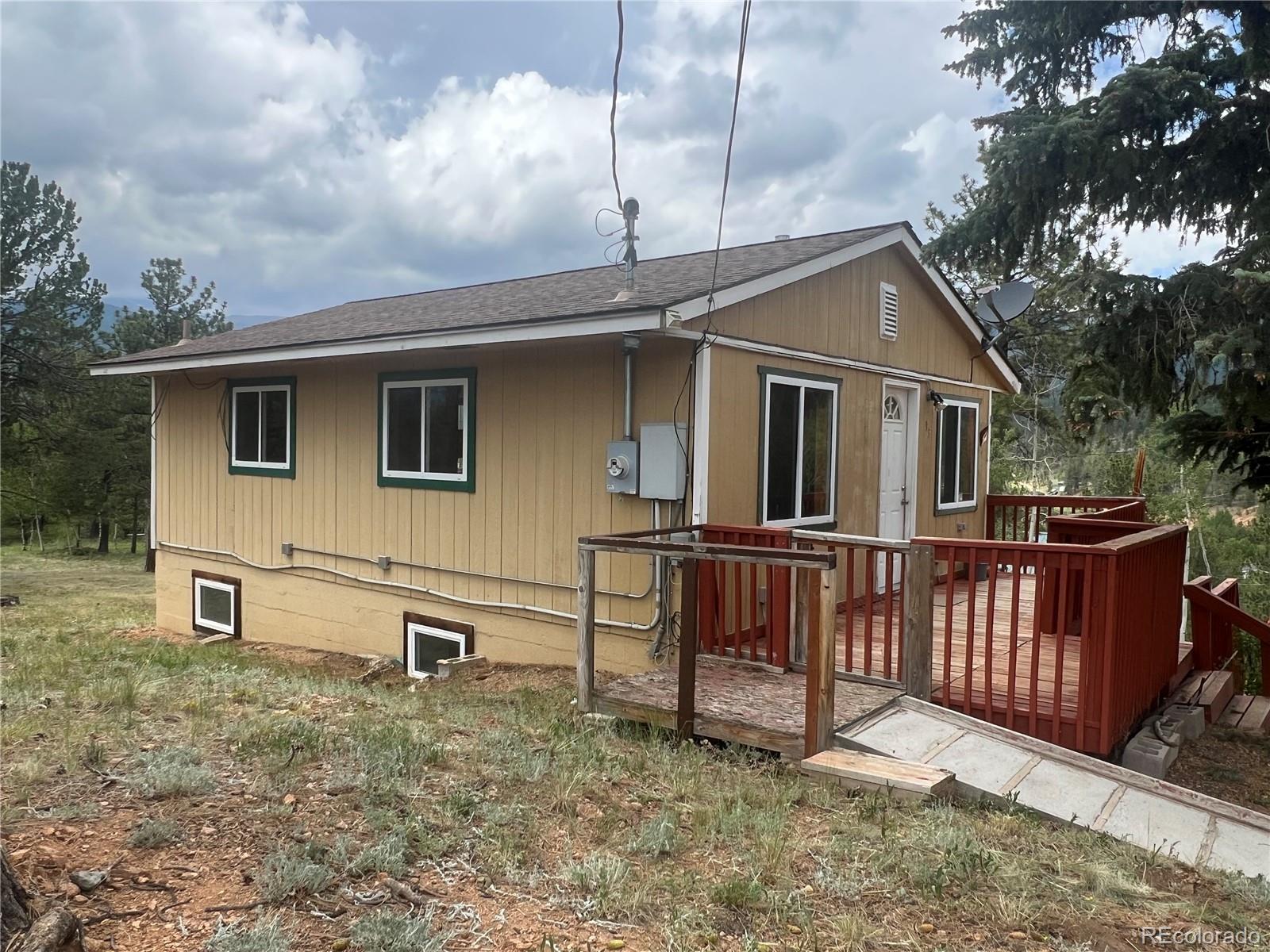 95 Appleby Street Bailey, CO 80421 - Photo 21 of 36 a view of a house with a yard