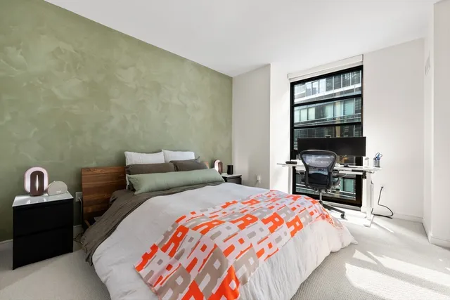 a bedroom with a bed and a cabinets