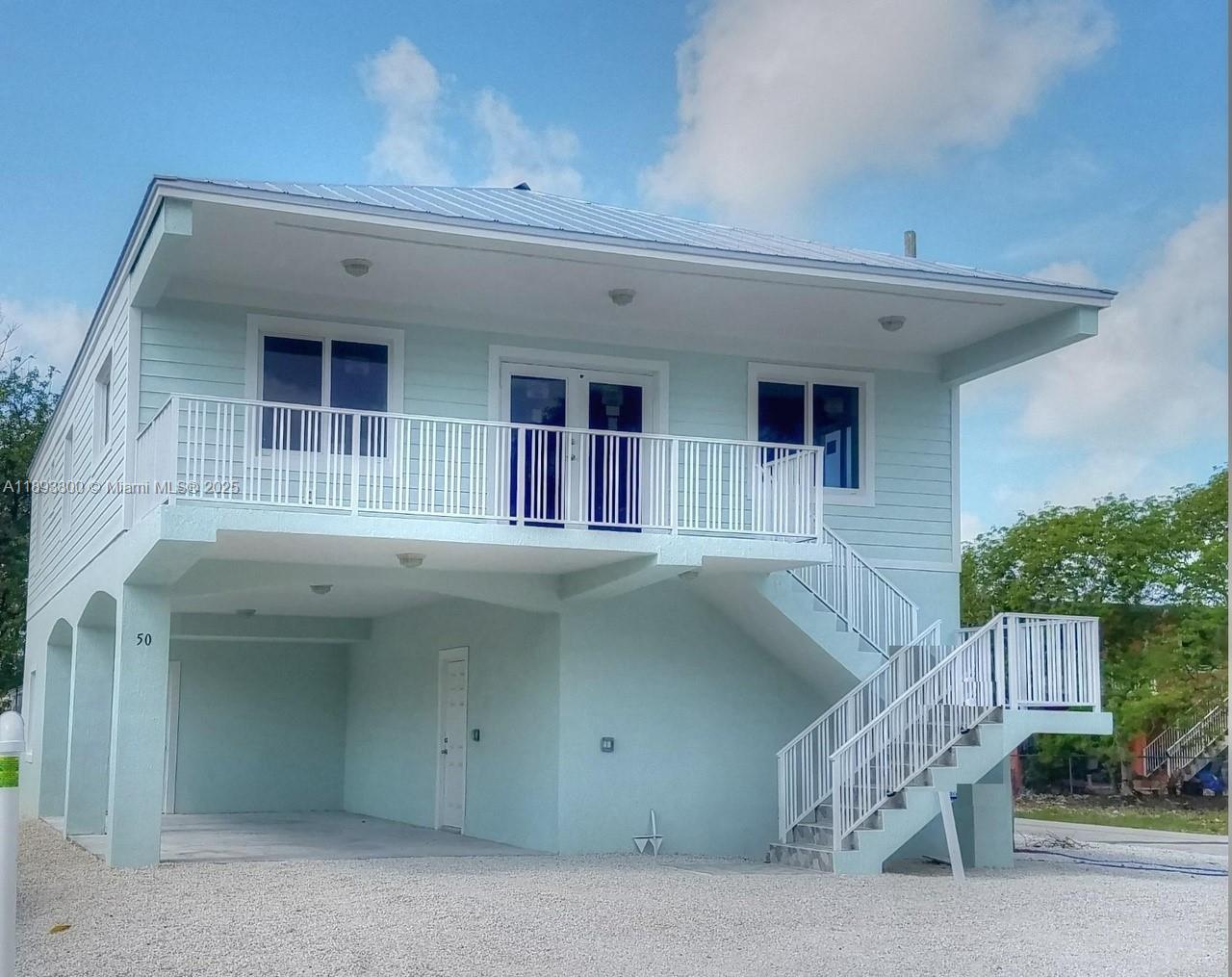 50 Orange Drive, Unit B Key Largo, FL 33037 - Photo 2 of 2 a front view of a house
