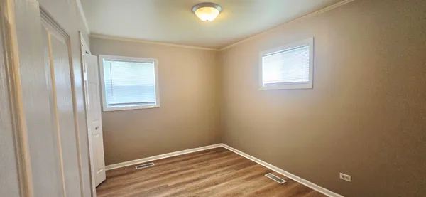 a view of room with window and closet area