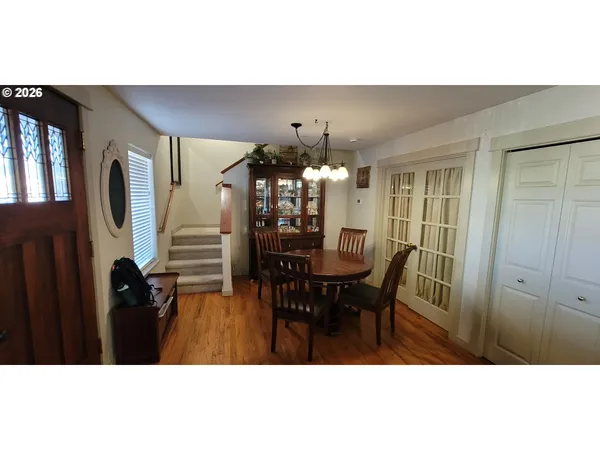 a view of a dining room with furniture and window