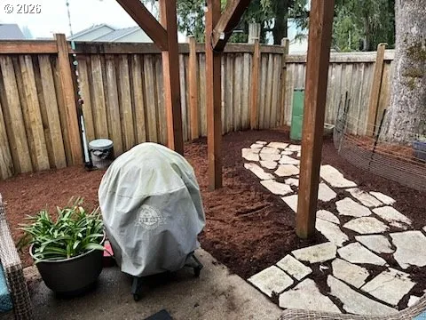 a view of a backyard with sitting area