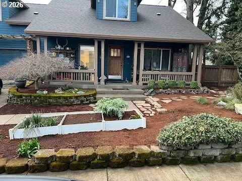 a front view of a house with garden