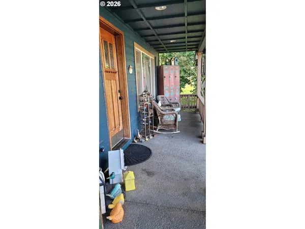 a view of living room with furniture and floor to ceiling window
