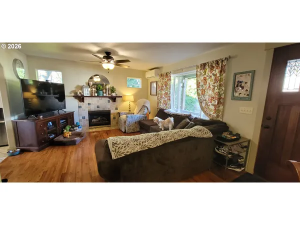 a living room with furniture and a flat screen tv