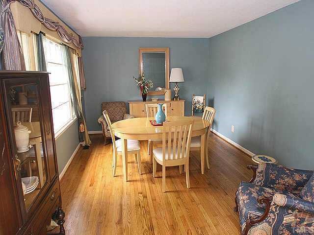 1701 Spring Drive Garner, NC 27529 - Photo 4 of 9 Large living room with hardwood floors was previously used for dining!