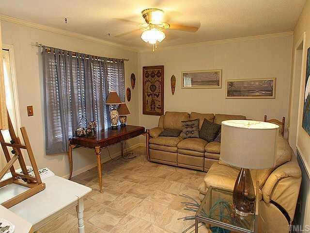 1701 Spring Drive Garner, NC 27529 - Photo 6 of 9 Note the updated flooring, ceiling fan and 2inch blinds!