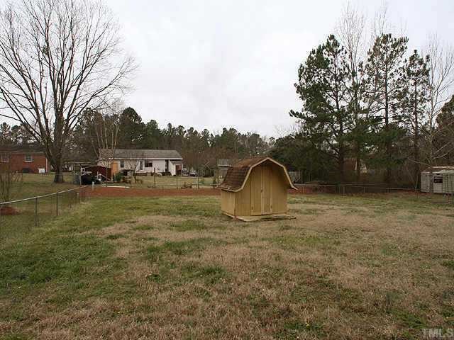 1701 Spring Drive Garner, NC 27529 - Photo 8 of 9 Great yard for the kids and the pets too! Note fence and shed!