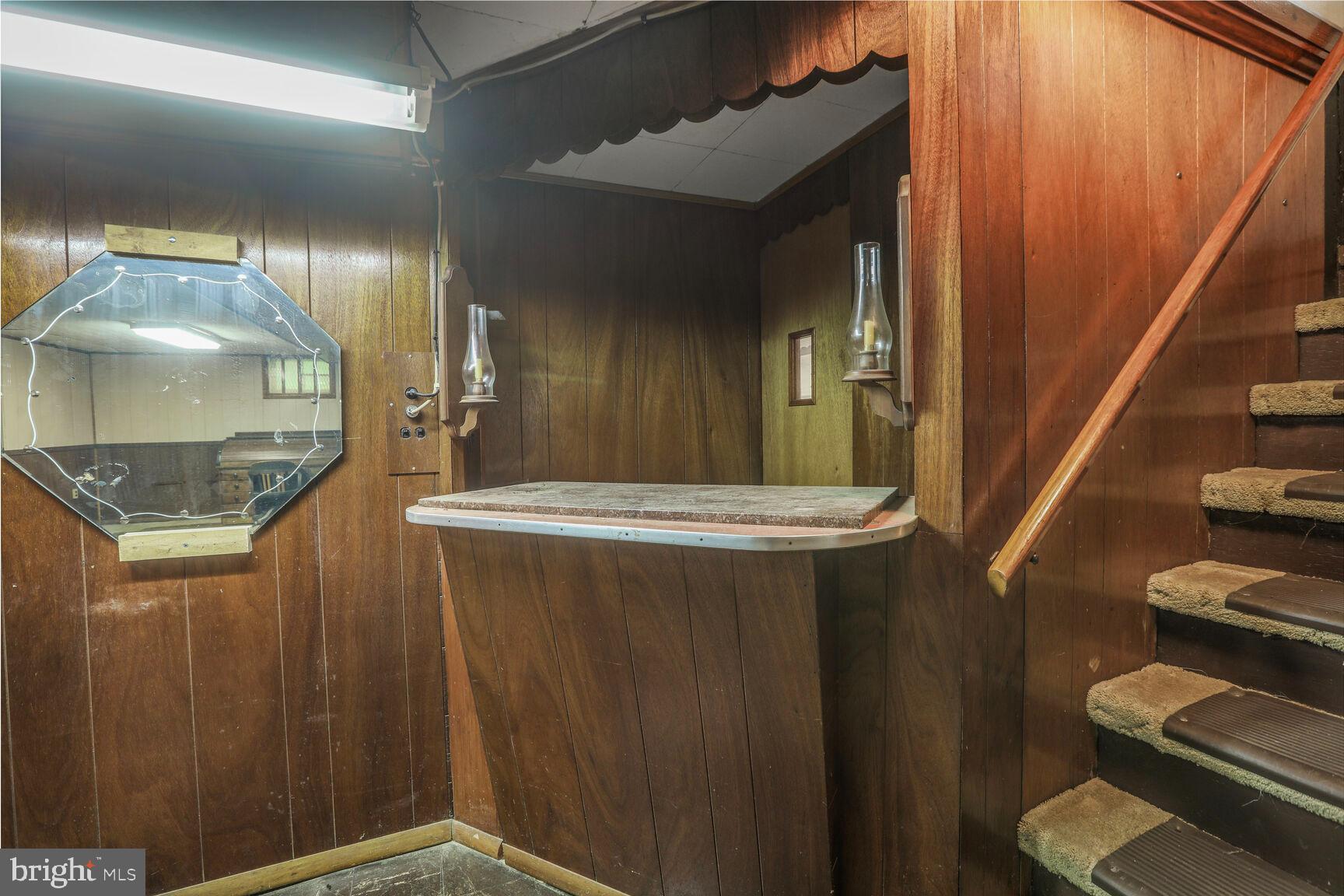 7423 Phelps Road Hanover, MD 21076 - Photo 21 of 28 a bathroom with a granite countertop sink and a mirror
