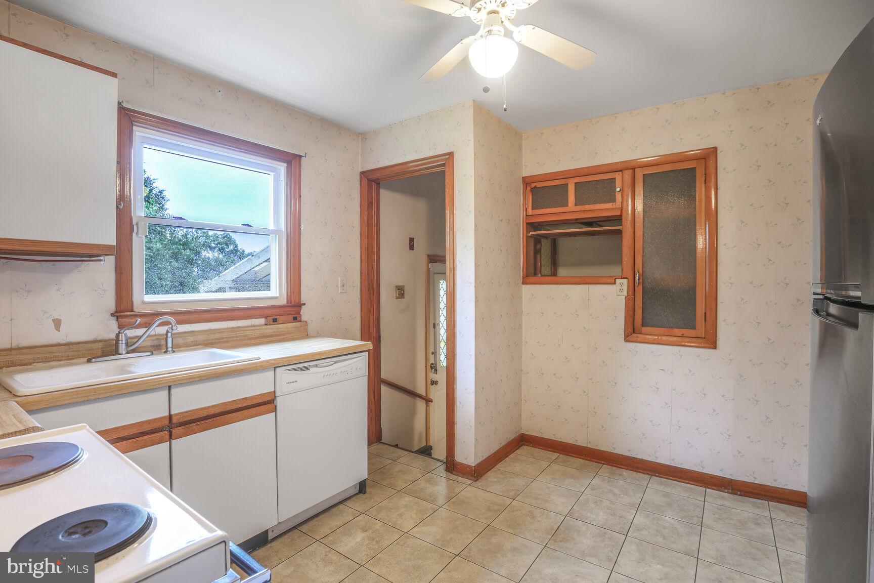7423 Phelps Road Hanover, MD 21076 - Photo 10 of 28 a view of a kitchen with a sink and a window