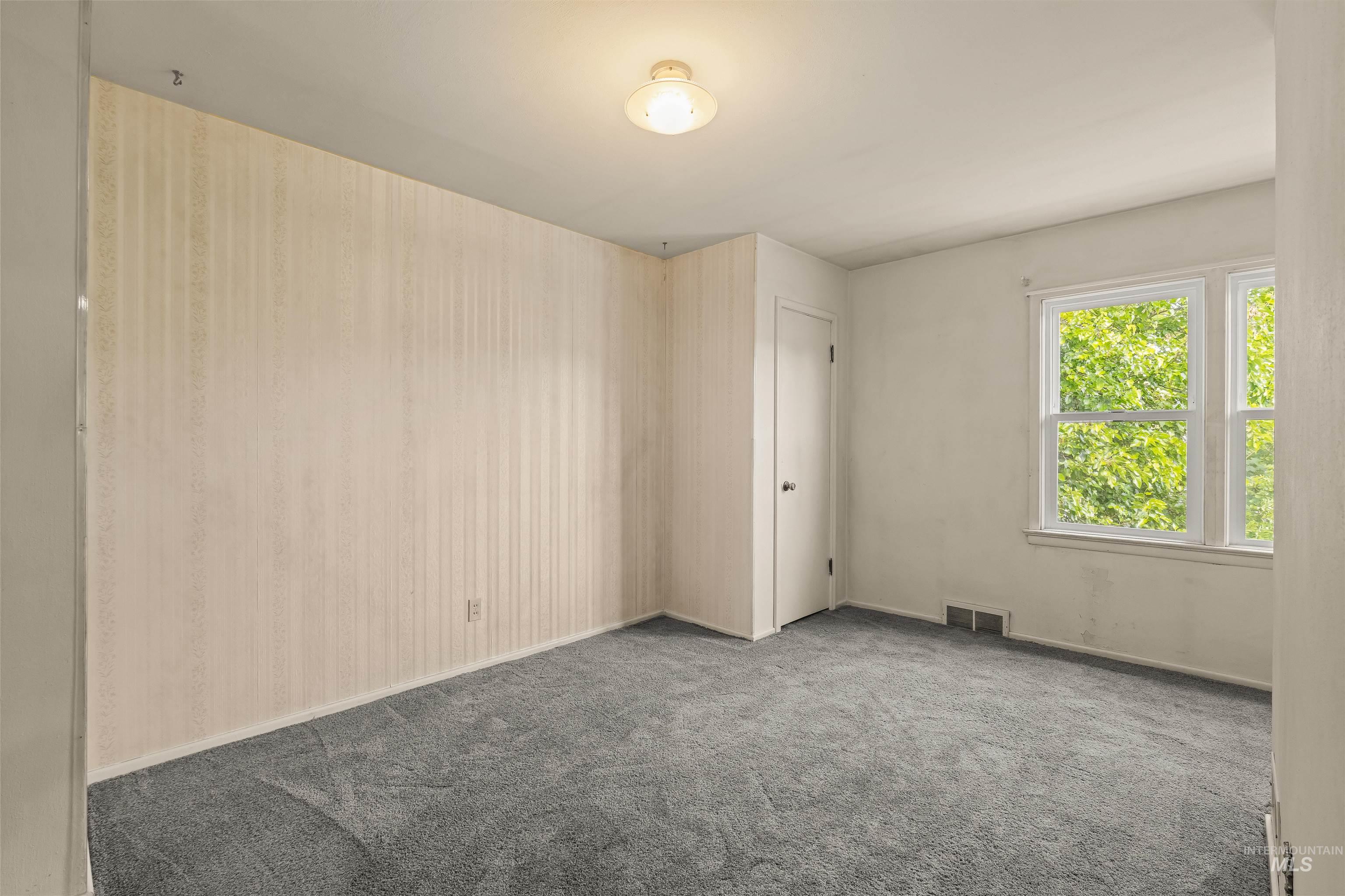 1663 9th Avenue Lewiston, ID 83501 - Photo 27 of 36 Room featuring light gray carpeting, a double window with white trim, and a flush mount ceiling light fixture