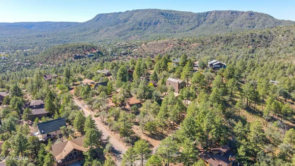 a view of a lush green hillside and a building