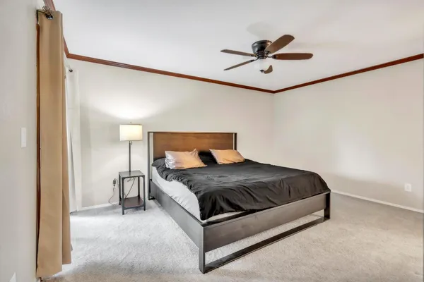 a bedroom with a bed and window