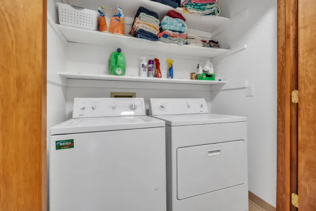 a bedroom with bed and a window
