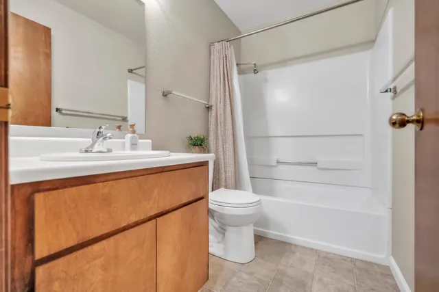 an aerial view of a house with a yard and a garage