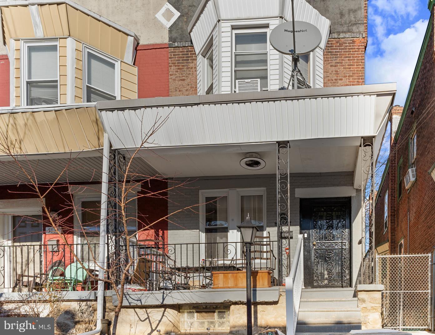 5129 Keyser Street Philadelphia, PA 19144 - Photo 2 of 13 front view of a building with a glass door