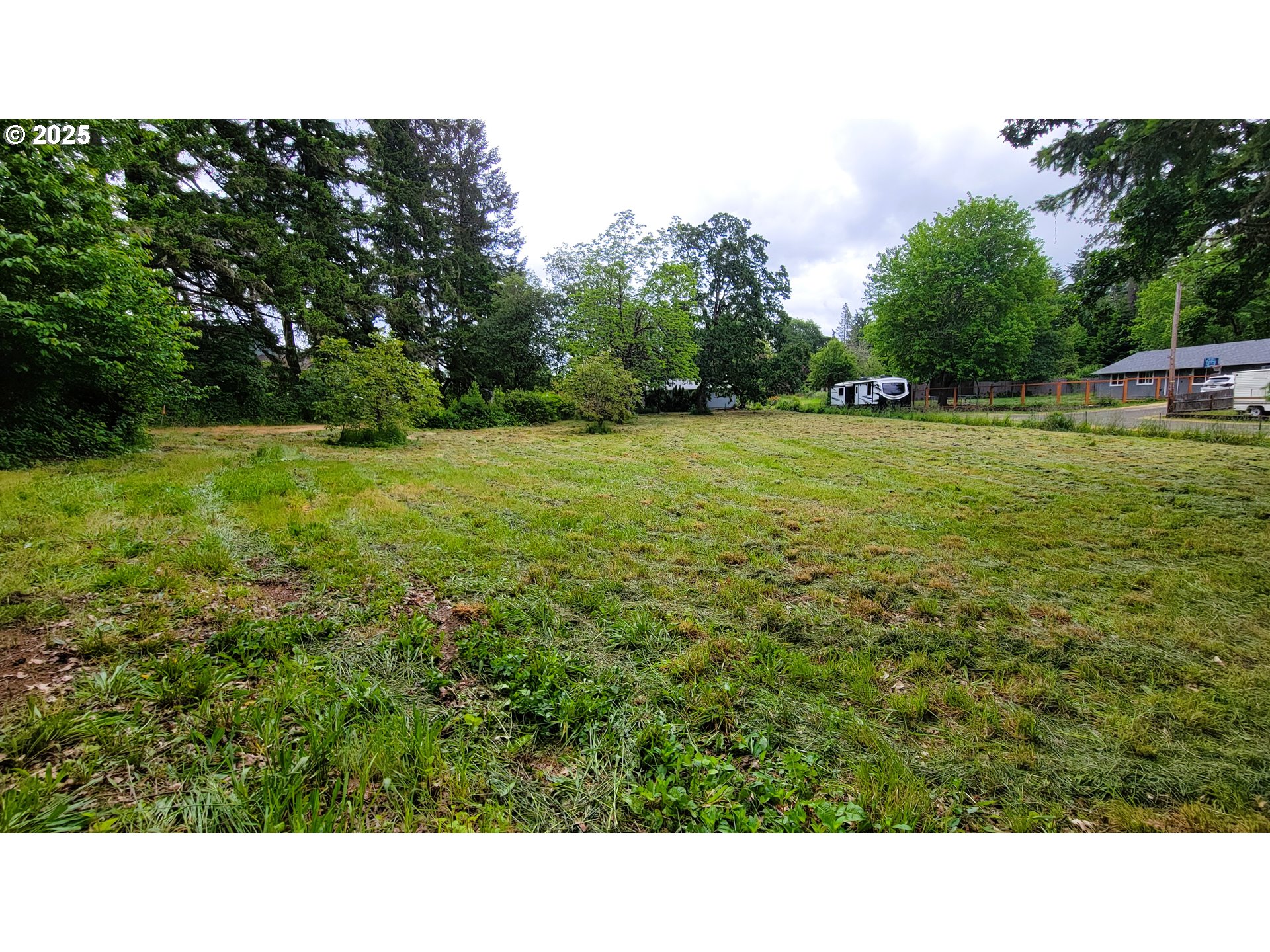 88109 8th Street Veneta, OR 97487 - Photo 10 of 11 a open area with trees in the background