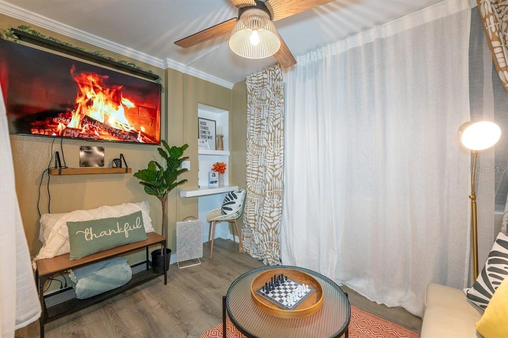 1233 North Atlantic Avenue, Unit 3140 Daytona Beach, FL 32118 - Photo 17 of 33 a living room with furniture and a flat screen tv