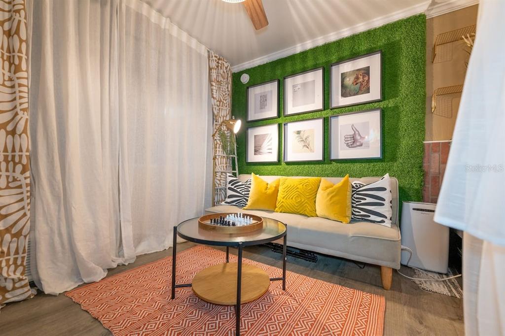 1233 North Atlantic Avenue, Unit 3140 Daytona Beach, FL 32118 - Photo 27 of 33 a living room with furniture and a window