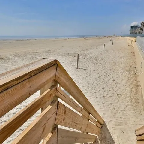 a view of a swimming pool with outdoor seating