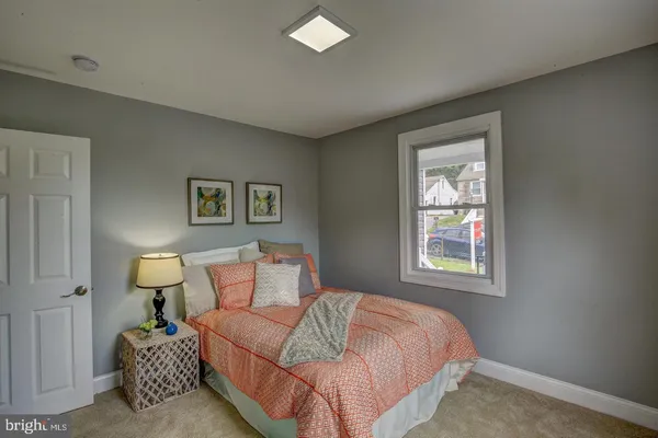 a bedroom with a bed and night stand