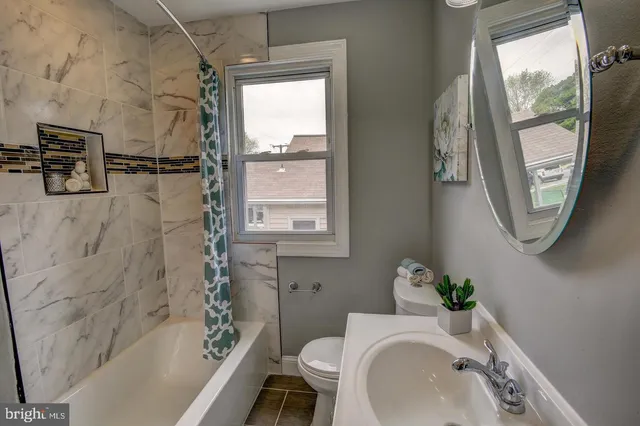 a bathroom with a sink toilet and a bathtub