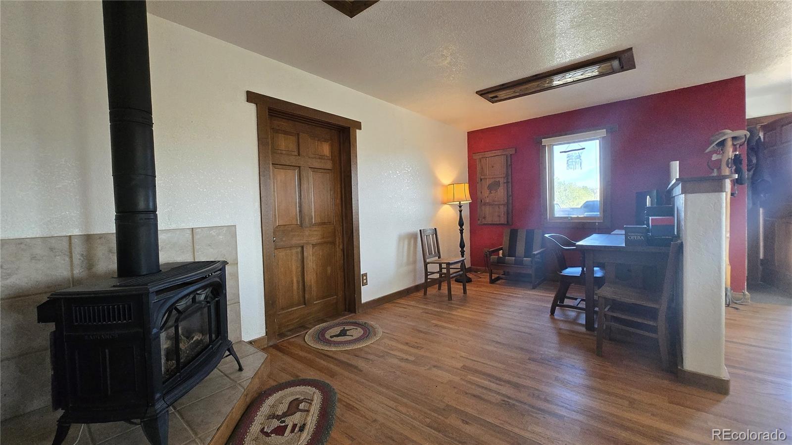 957 Vega Road Walsenburg, CO 81089 - Photo 12 of 30 a view of a livingroom with furniture and hardwood floor